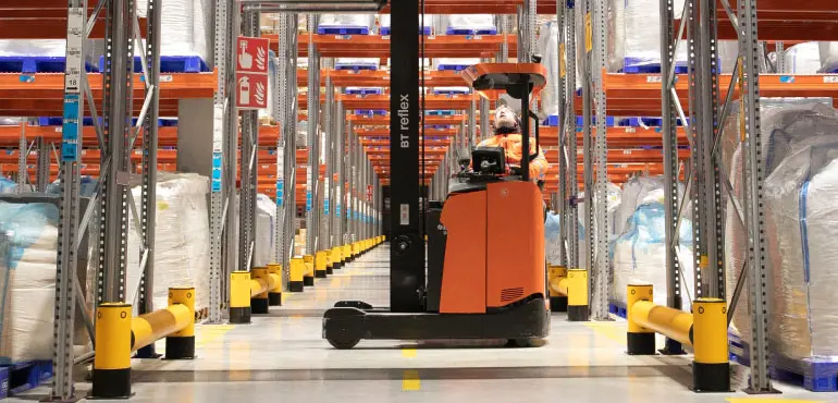 forklift-safely-operating-in-a-warehouse-1.webp